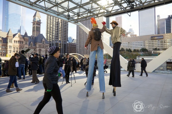 Protesters on stilts at City Hall